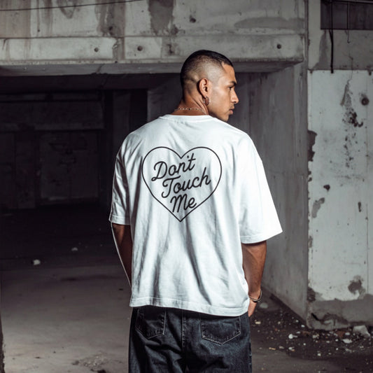 White don’t touch me graphic t-shirt worn from back with heart text design