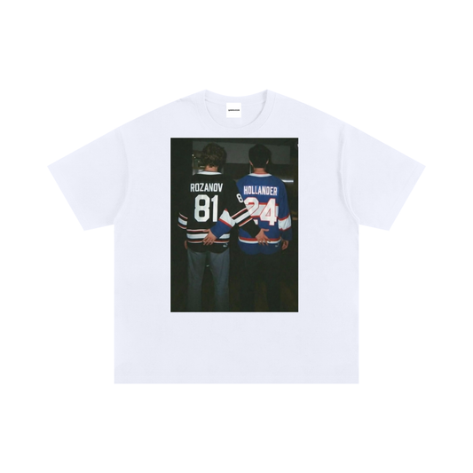 White unisex graphic t-shirt featuring a hockey rivalry inspired print with two players standing side by side, oversized fit.