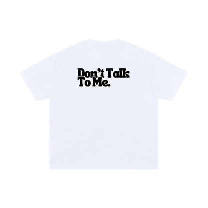 White graphic T-shirt with bold “Don’t Talk To Me” text printed across the back