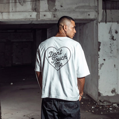 White don’t touch me graphic t-shirt worn from back with heart text design