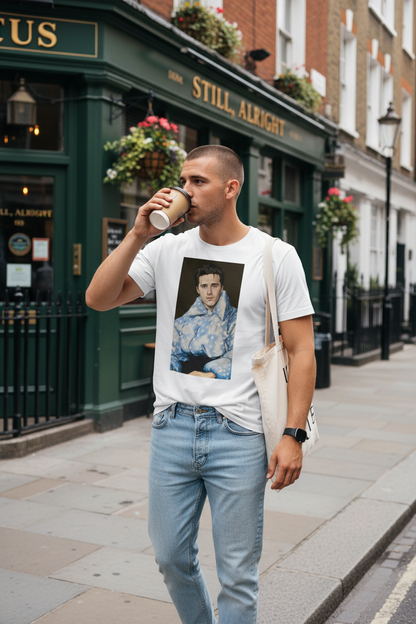 Hipster guy with buzzcut, tote bag and coffee in Chelsea wearing Still, Alright Tee