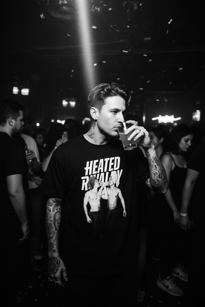 Hot edgy guy wearing Heated Rivalry tee in nightclub with black and white flash photography